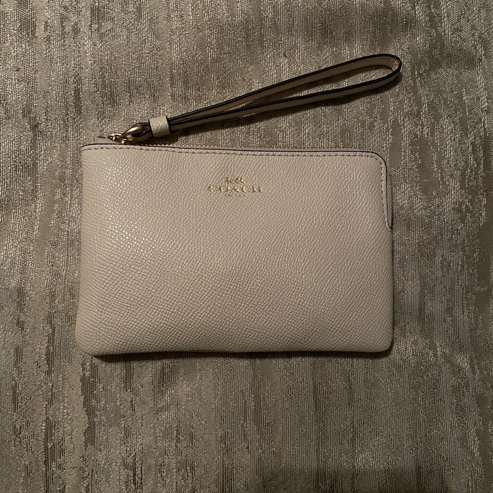 Coach cream colored wristlet coin purse